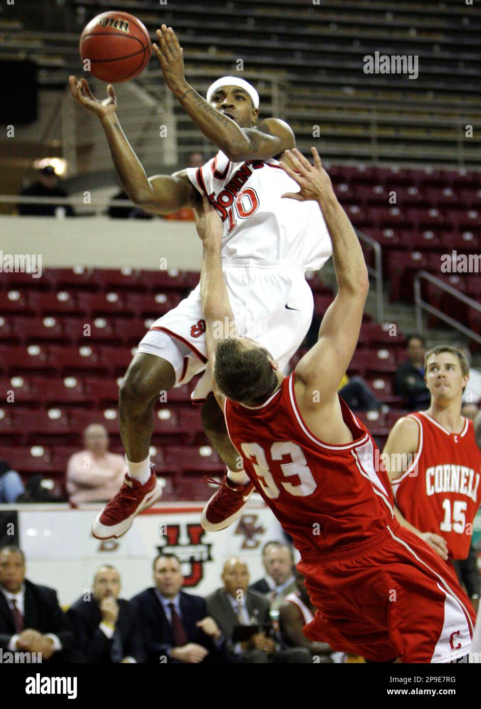 St. John's guard Quincy Roberts drives to the basket past Cornell center  Alex Tyler in the second half of a NCAA college basketball game in Boston  on Monday, Nov. 17, 2008. St.