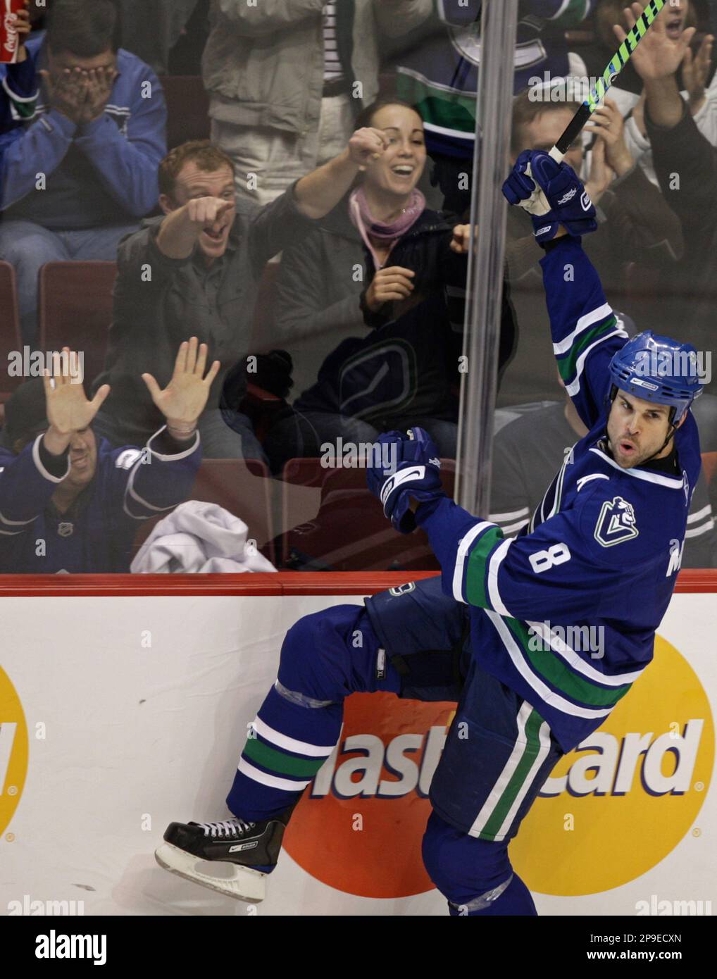 Vancouver Canucks' Willie Mitchell Celebrates After Scoring Against The ...