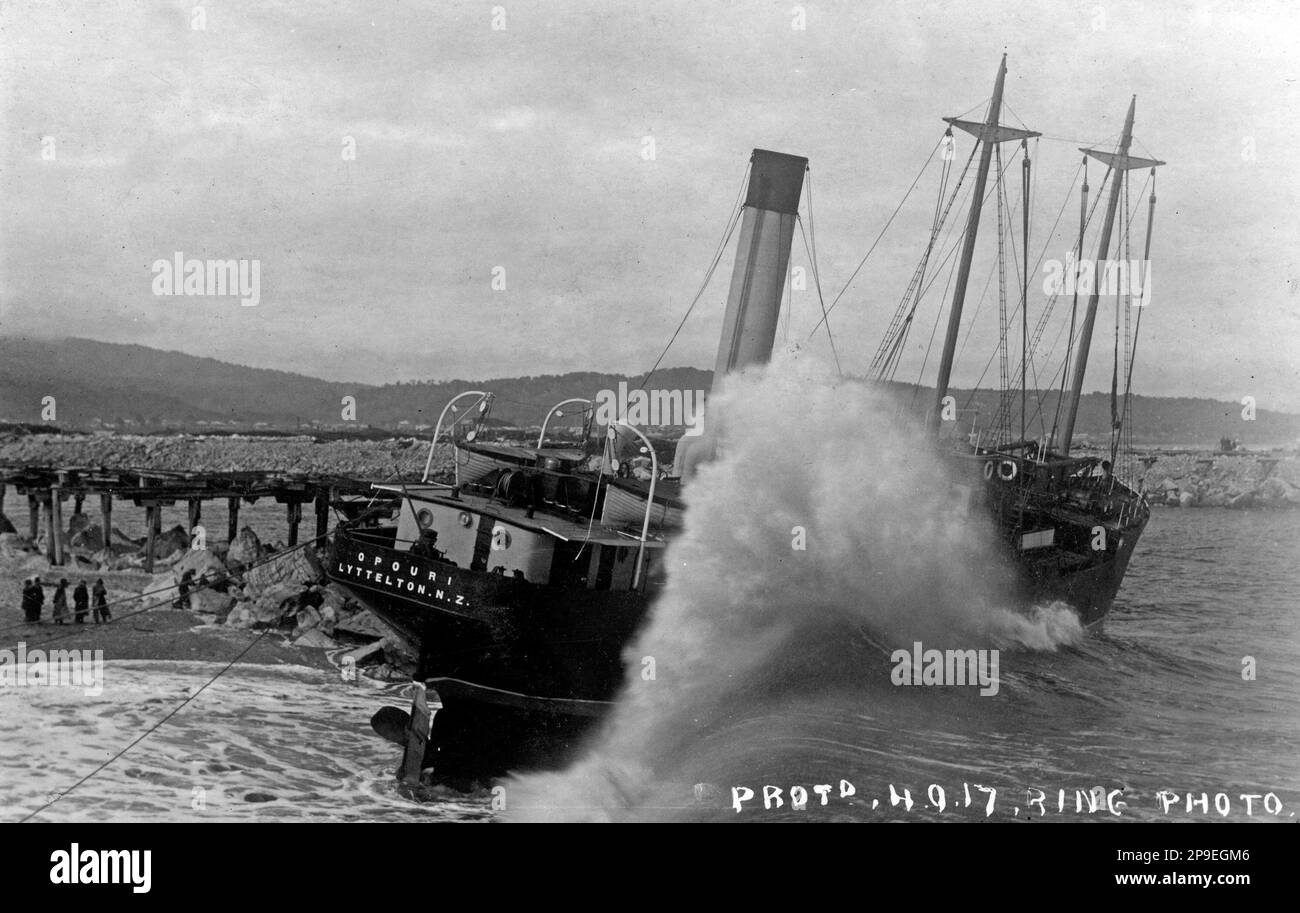 Waves breaking up the Opouri, which was washed onto the north breakwater after her steering gear failed at Greymouth, Westland, New Zealand, on 3.9.1917, and became a total wreck. All 17 crew members escaped from the iron, screw steamship, which weighed 570 tons gross and had a net register of 218 tons. Stock Photo
