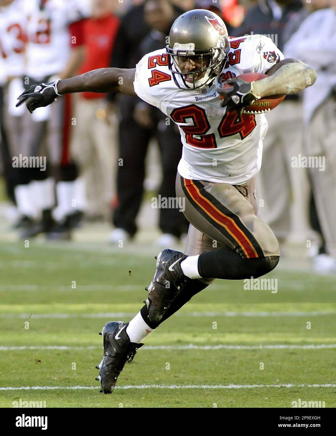 Tampa Bay Buccaneers running back Cadillac Williams (24) finds an opening  in the Detroit Lion defense during an NFL football game between the  Buccaneers and the Lions Sunday in Tampa, Fla, December