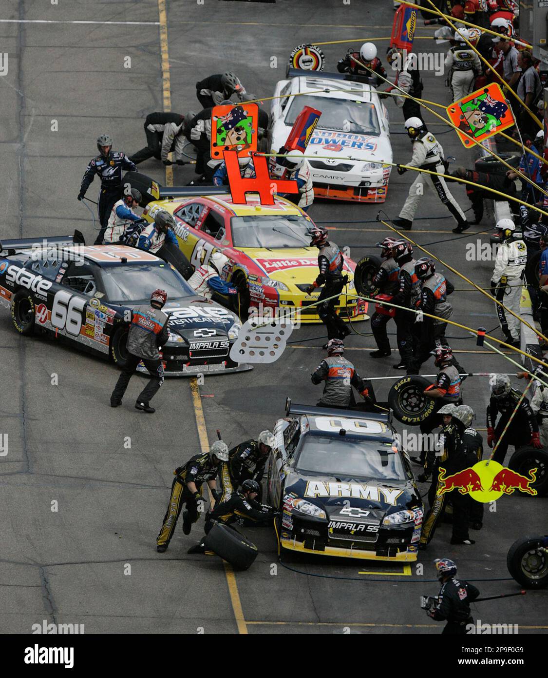 Scott Riggs 66 Scott Riggs (66) tries to pull into his stall as other drivers have ...