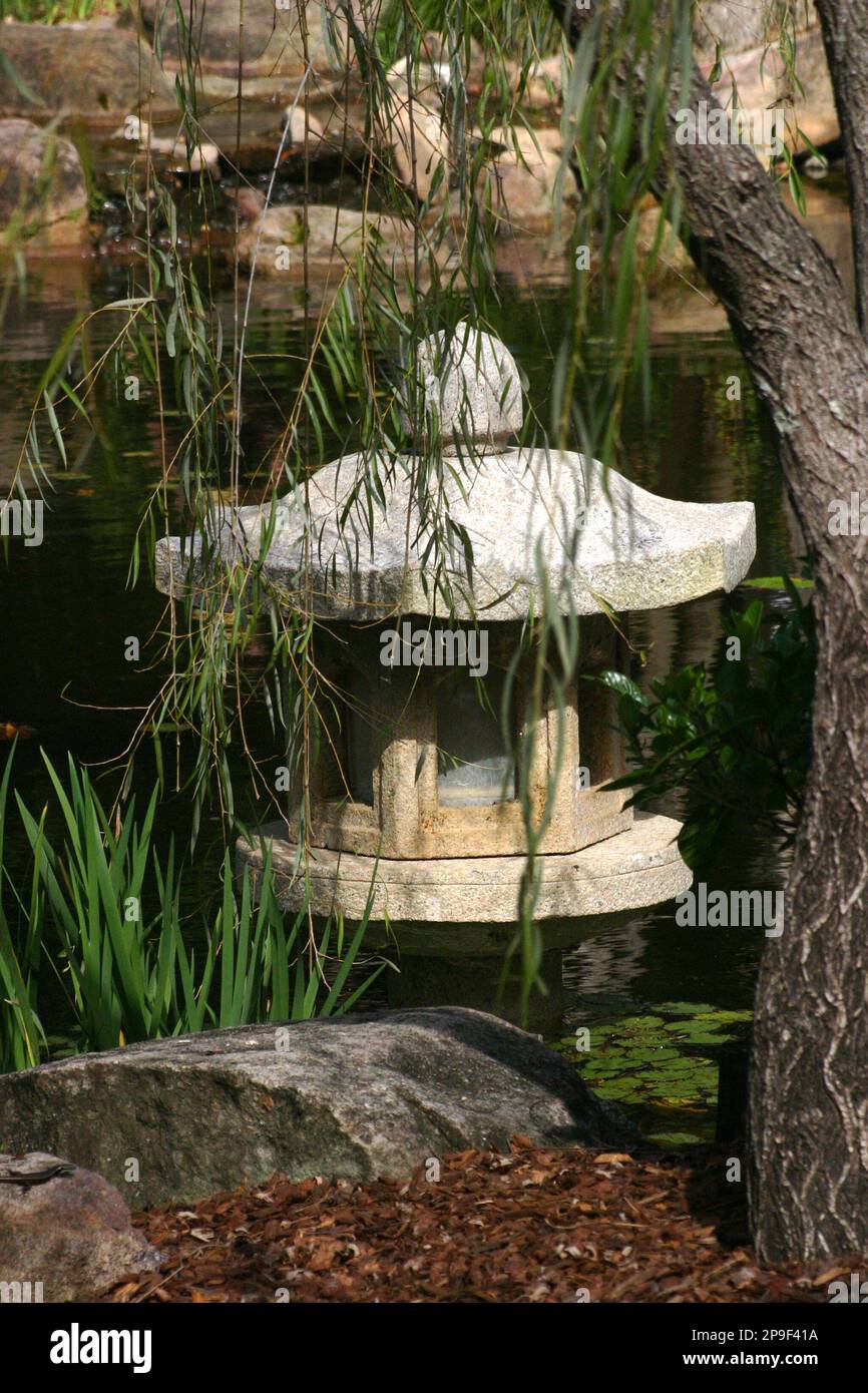 STONE JAPANESE PAGODA GARDEN ORNAMENT SET IN POND Stock Photo Alamy