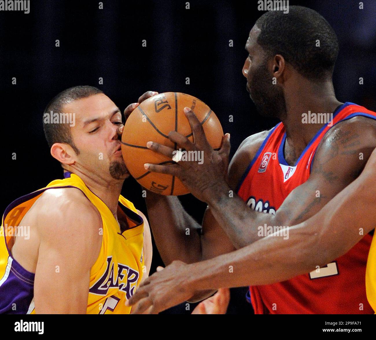 Los Angeles Clippers forward Tim Thomas, left, hits Los Angeles Lakers guard Jordan Farmar in the face with the ball during the second half of an NBA basketball game, Wednesday, Nov. 5, 2008, in Los Angeles. The Lakers won 106-88. (AP Photo/Mark J. Terrill) Stock Photo