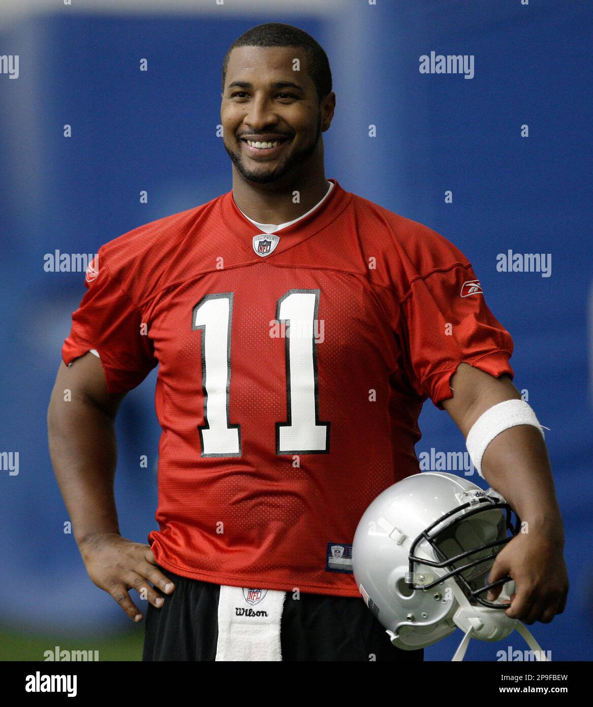 Detroit Lions quarterback Daunte Culpepper smiles after football
