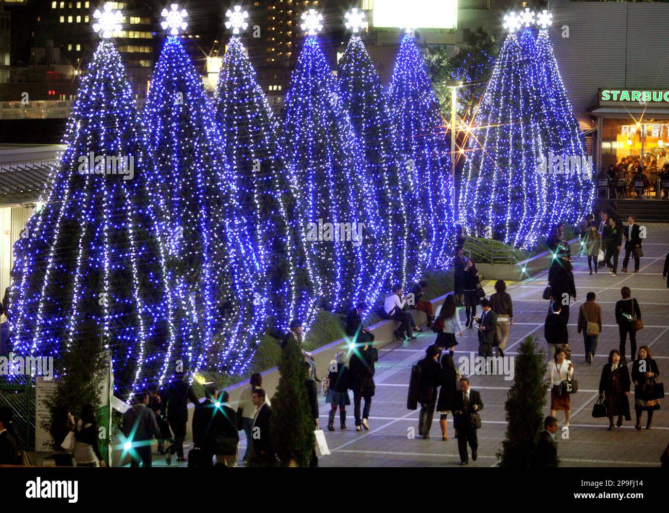 People Walk By Illuminated Trees In Tokyo Tuesday Nov 4 2008 A People Walk By Illuminated Trees In Tokyo Tuesday Nov 4 2008 A