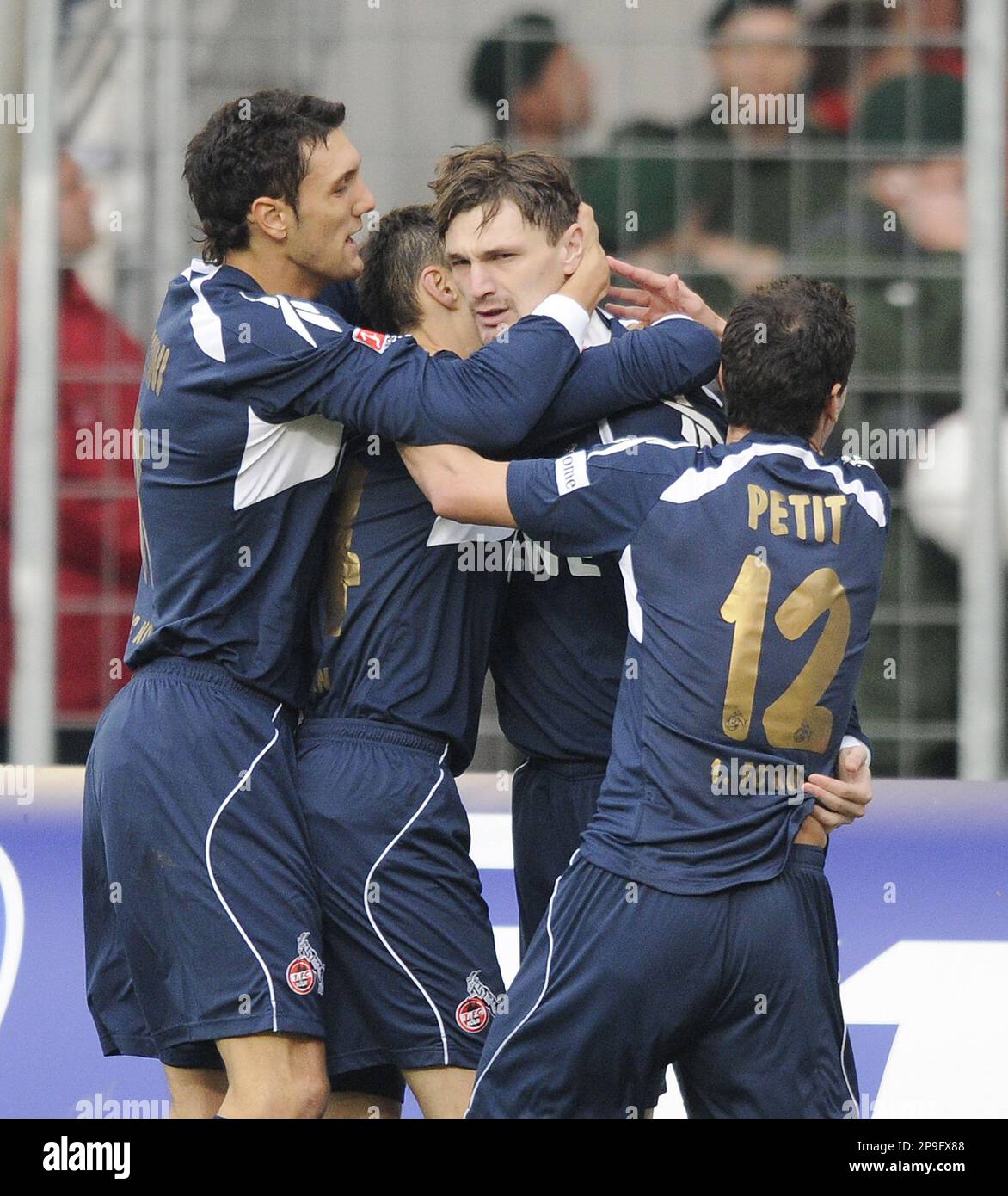 Cologne's Kevin Pezzoni, Sergiu Radu, Milivoje Novakovic and Petit, from left to right, celebrate the opening goal during the German first division Bundesliga soccer match between VfB Stuttgart and 1. FC Cologne in Stuttgart, Germany, on Saturday, Nov. 1, 2008. (AP Photo/Daniel Maurer)**eds note: German spelling of Cologne is Koeln** ** NO MOBILE USE UNTIL 2 HOURS AFTER THE MATCH, WEBSITE USERS ARE OBLIGED TO COMPLY WITH DFL-RESTRICTIONS, SEE INSTRUCTIONS FOR DETAILS ** Stock Photo