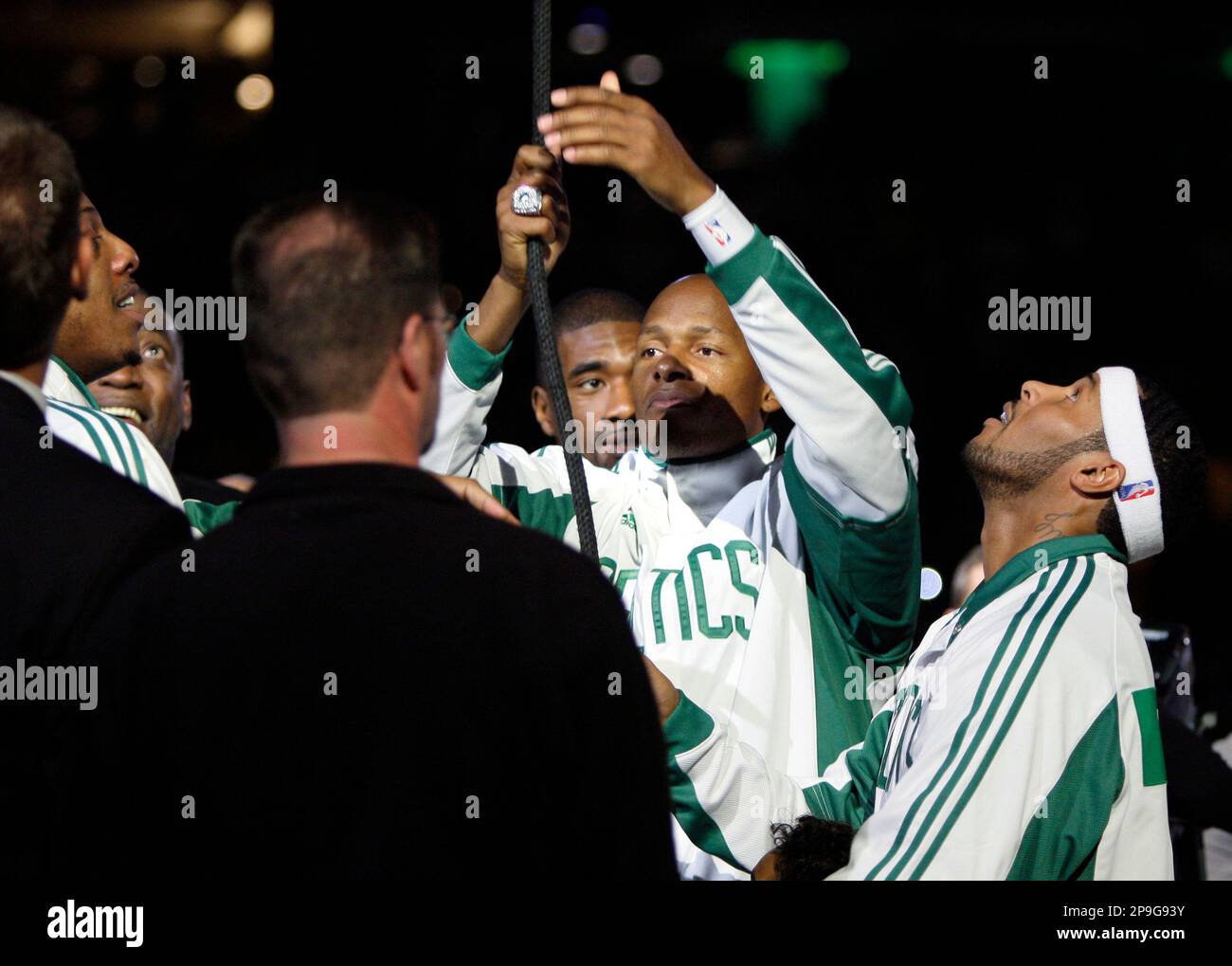 Boston Celtics' Ray Allen pulls the rope as teammate Eddie House, right