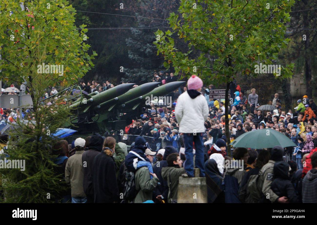 Spectators crowd to overlook a military parade marking the 90th