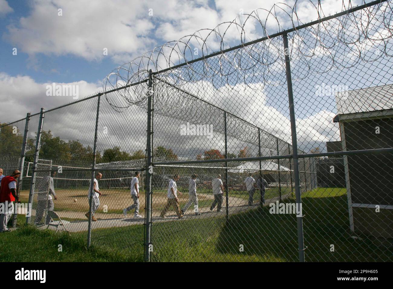 Inmates walk through the yard at Marble Valley Correctional Facility in