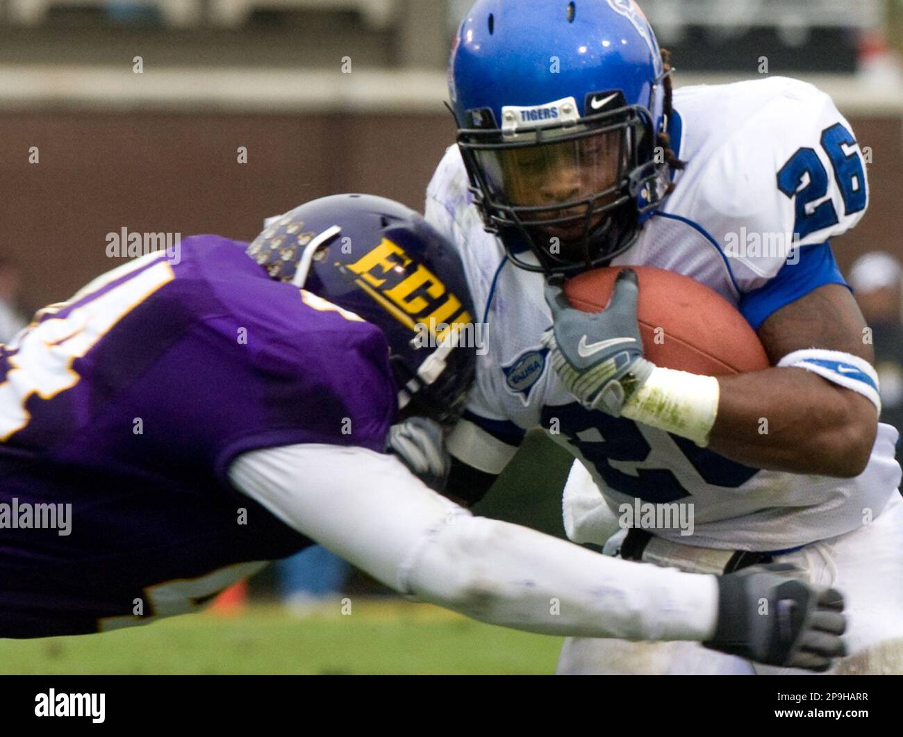 Memphis running back Curtis Steele, right, braces as he's hit by East