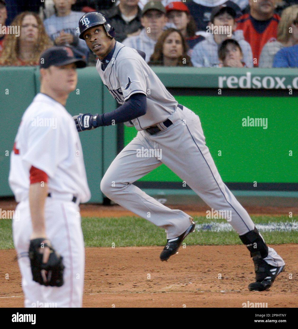Boston Red Sox pitcher Jon Lester, left, and Tampa Bay Rays' B.J. Upton  watch Upton's three run home run in the third inning against the Red Sox in  Game 3 of the