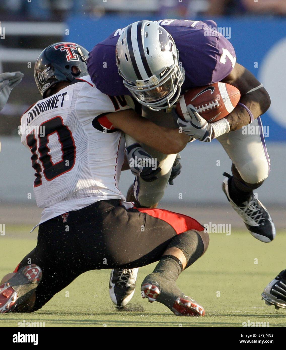 Kansas State wide receiver Lamark Brown, right gets past  Louisiana-Lafayette's Daylon McCoy (4) and Derik Keyes (20) during the  fourth quarter of an NCAA college football game Saturday, Sept. 27, 2008, in