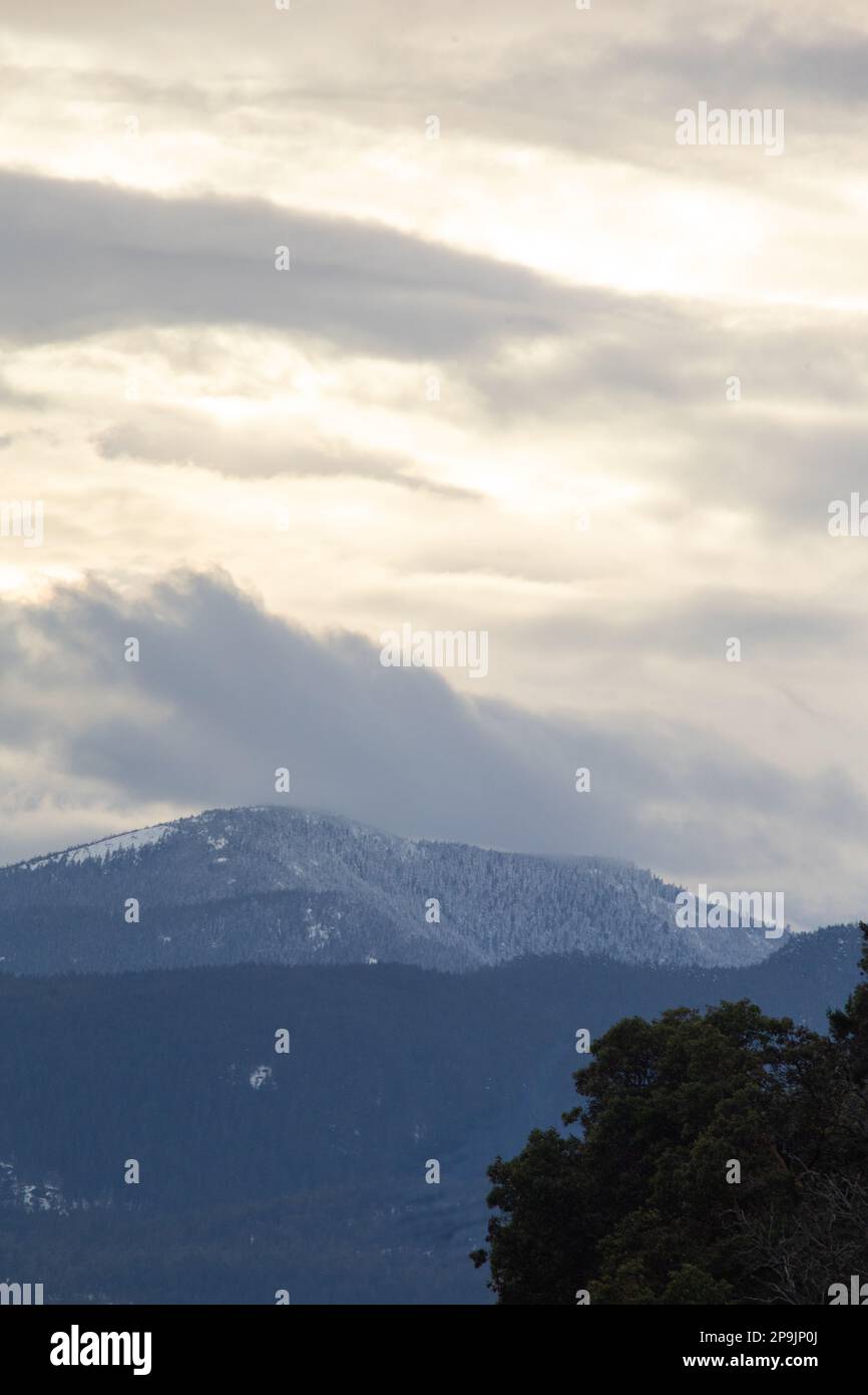 Clouds rolling over peaks hi-res stock photography and images - Alamy