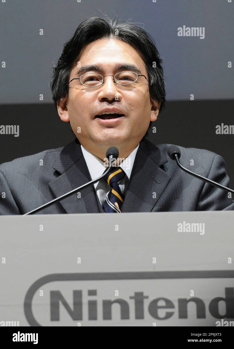 Nintendo President Satoru Iwata speaks as he unveils a Nintendo