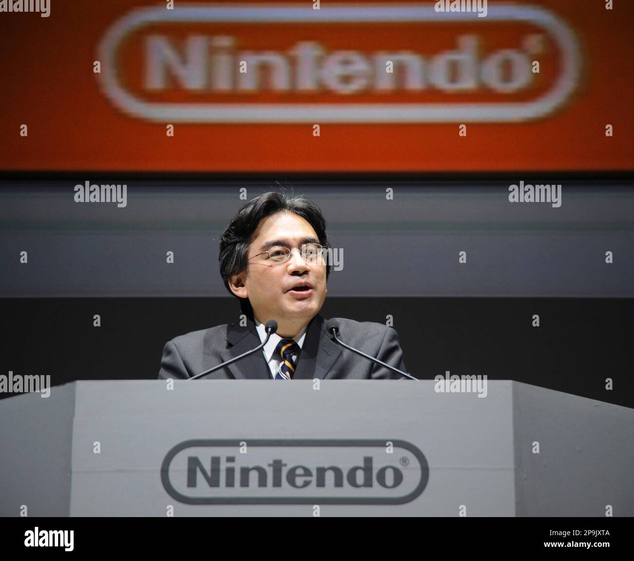 Nintendo President Satoru Iwata speaks as he unveils a Nintendo