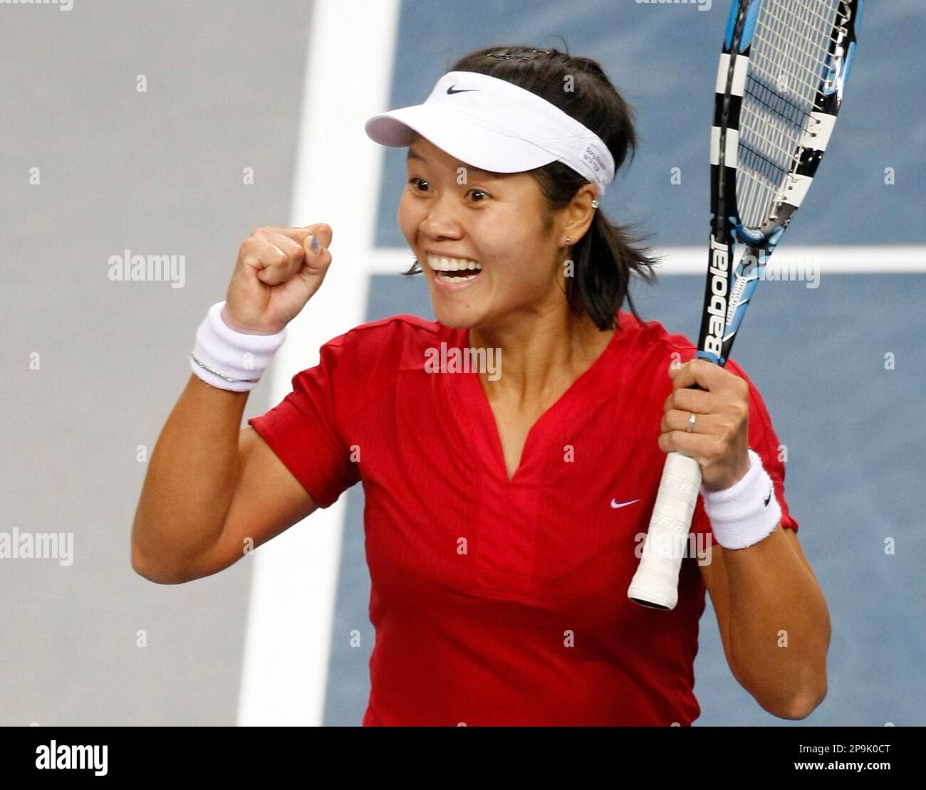 Na Li from China reacts after defeating Serena Williams from the USA during their 2nd round match at the Porsche Grand Prix tennis tournament in Stuttgart, Germany, Wednesday, Oct