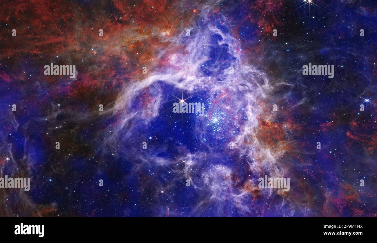 Space. 17th Jan, 2023. The Enduring Stellar Lifecycle in 30 Doradus. Chandra X-ray Observatory teamed up with the Webb telescope to create a new stunning composite image of the Tarantula Nebula. Chandra's X-rays (shown in royal blue and purple) identify extremely hot gas and supernova explosion remnants, while Webb reveals forming baby stars. Unlike most nebulas in our Milky Way, the Tarantula Nebula has a chemical composition similar to that of conditions in our galaxy several billion years ago, when star formation was at its peak. For astronomers, this nebula is the perfect window into h Stock Photo