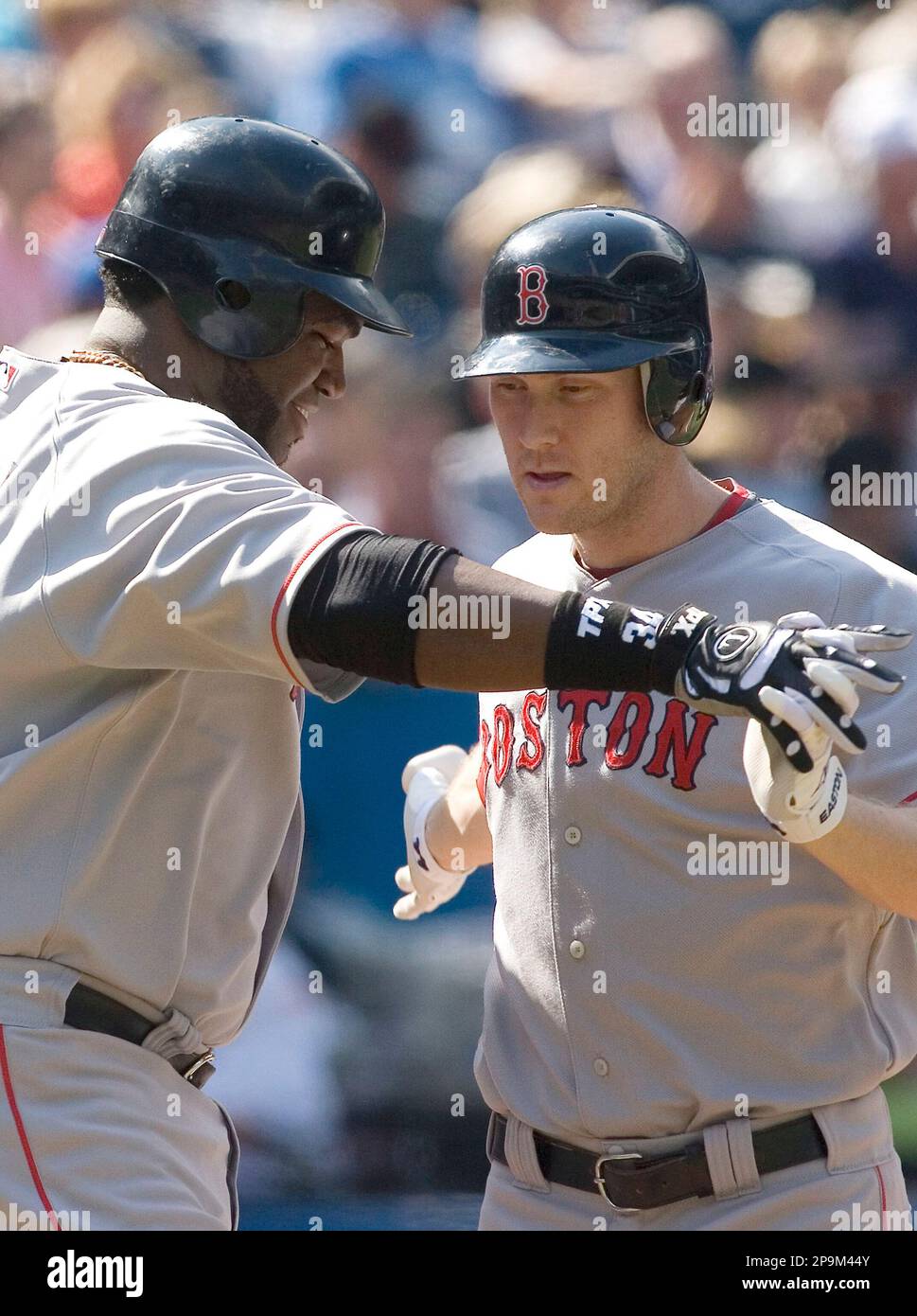 In this Oct. 6, 2008 photo Boston Red Sox's Jason Bay scores the