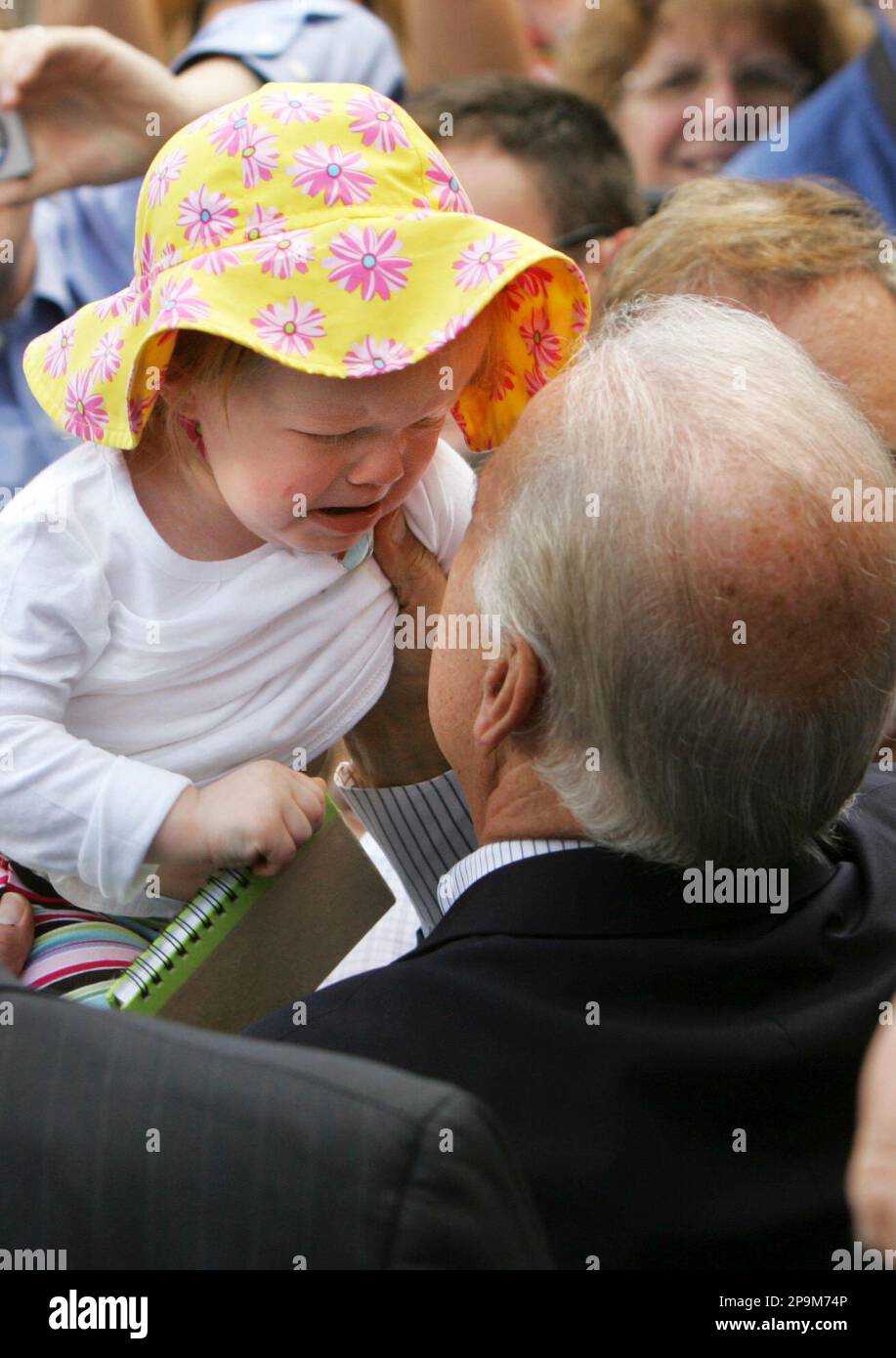 A crying baby is passed to Democratic vice presidential candidate Sen. Joe  Biden, D-Del., as he greets the crowd at a campaign rally for women,  Friday, Sept. 19, 2008, held in Sterling,, image size:917x1390