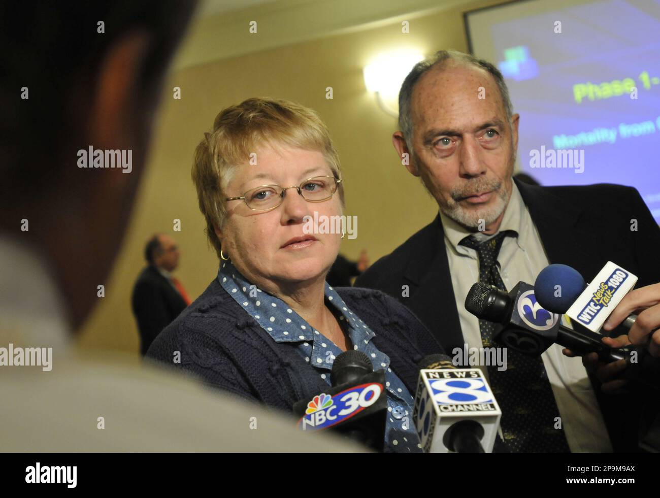 Carol Shea, left, who lost her husband to brain cancer, and Attorney  Matthew Shafner talk to the media after First Phase results from the Patt &  Whitney Cancer Study were released in