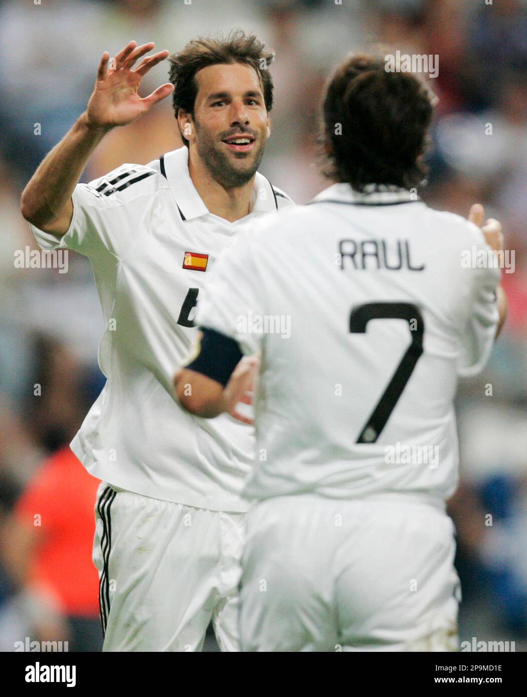Real Madrid's Ruud Van Nistelrooy of Netherlands, left, reacts with fellow  team member Raul Gonzalez, after scoring a goal during their Champions  League Group H soccer match against Bate at the Santiago
