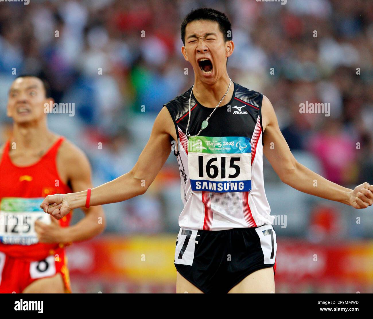 Hong Kong's So Wa Wai reacts after crossing the finish line