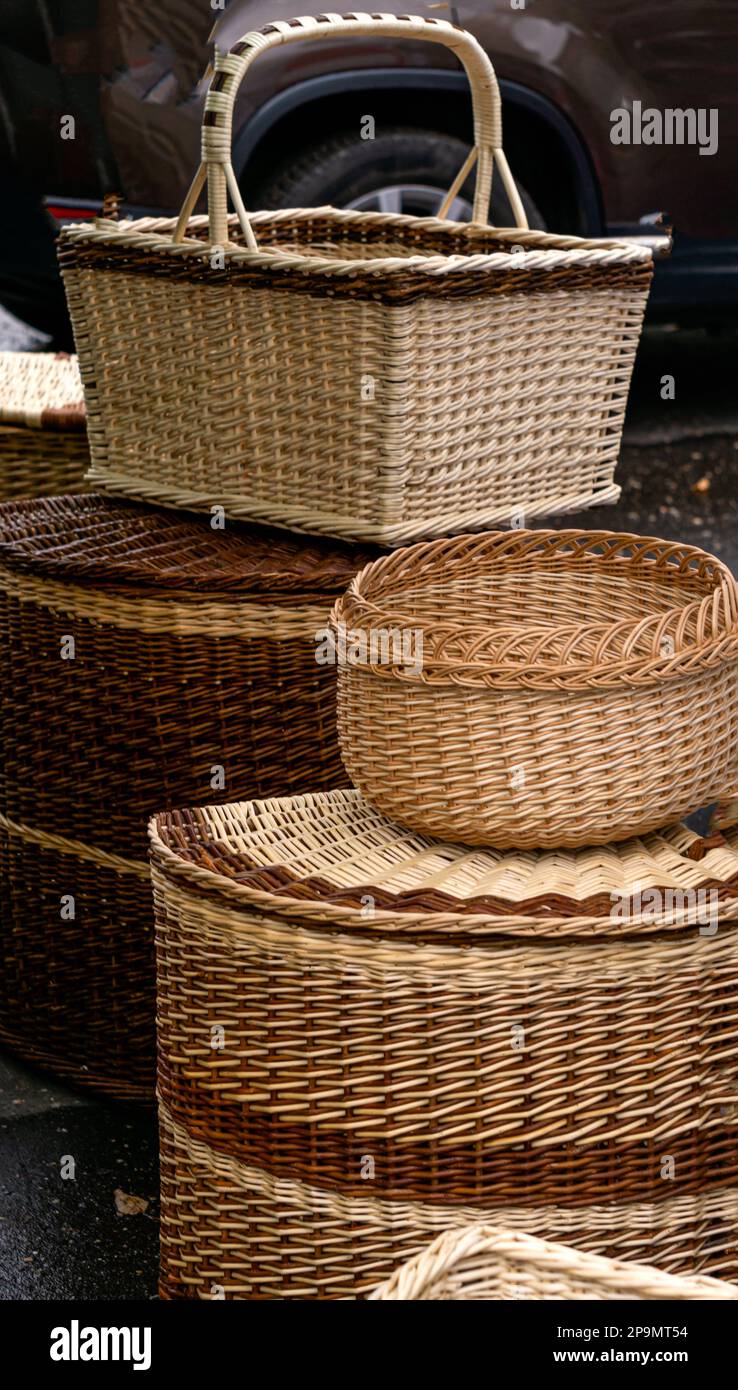 Many different wicker baskets made of natural material closeup at the