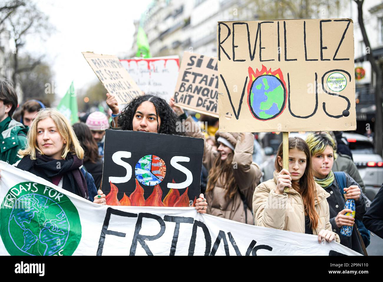 Paris, France. 10th Mar, 2023. Young demonstrators and activists hold up banners and placards during a demonstration for climate and against global warming, organized by the youth movement, 'Fridays for Future' (FFF) on March 10, 2023 in Paris, France. Photo by Victor Joly/ABACAPRESS.COM Credit: Abaca Press/Alamy Live News Stock Photo