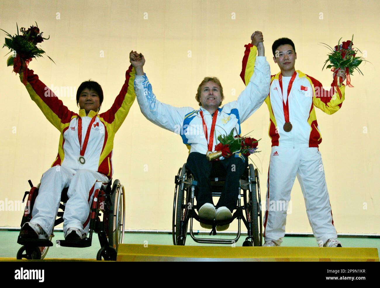 Gold medalist Sweden's Jonas Jacobsson, center, celebrates with silver