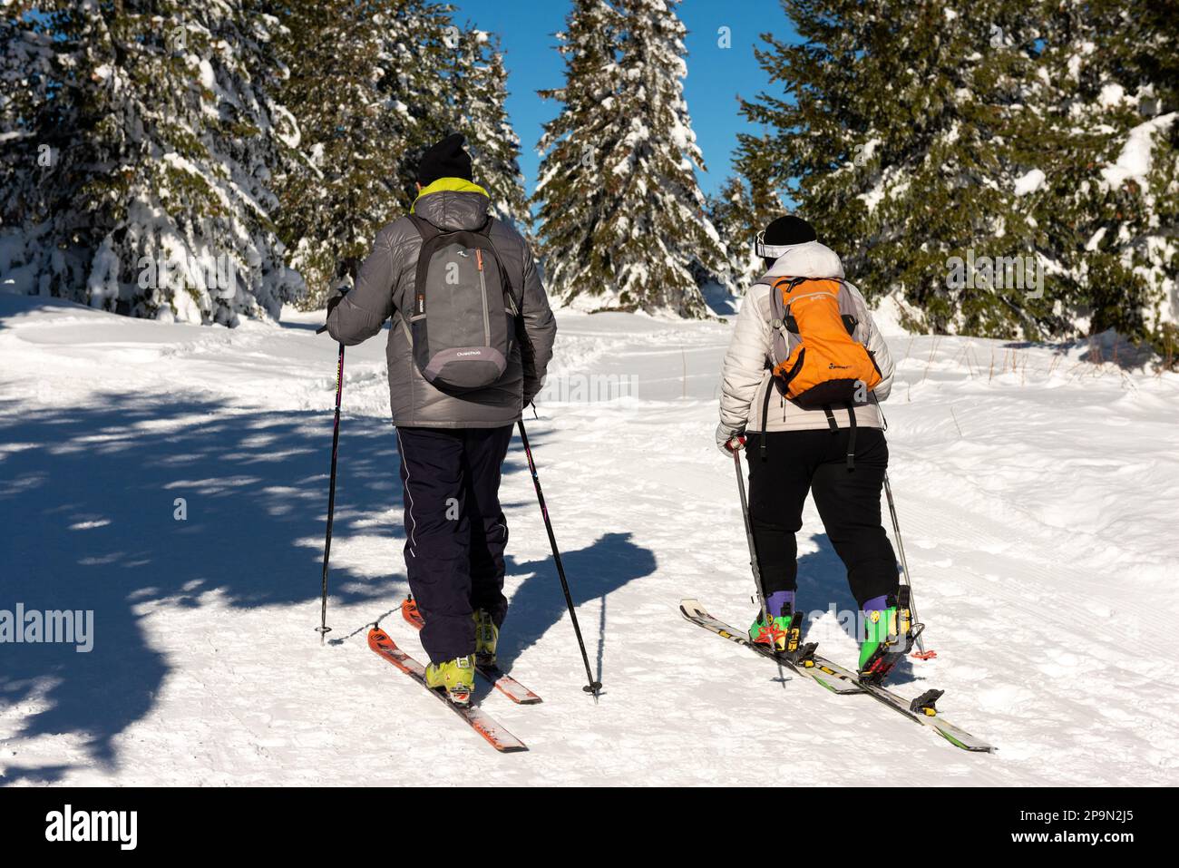 Couple of skiers enjoying the sunny Winter day in Vitosha Mountain above Sofia, Bulgaria, Eastern Europe, Balkans, EU Stock Photo