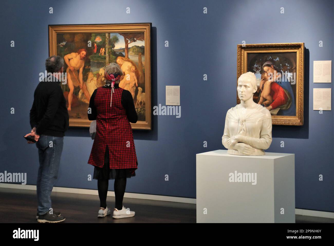 Visitors studying paintings at the Wallraf-Richartz Museum, Cologne, Germany Stock Photo