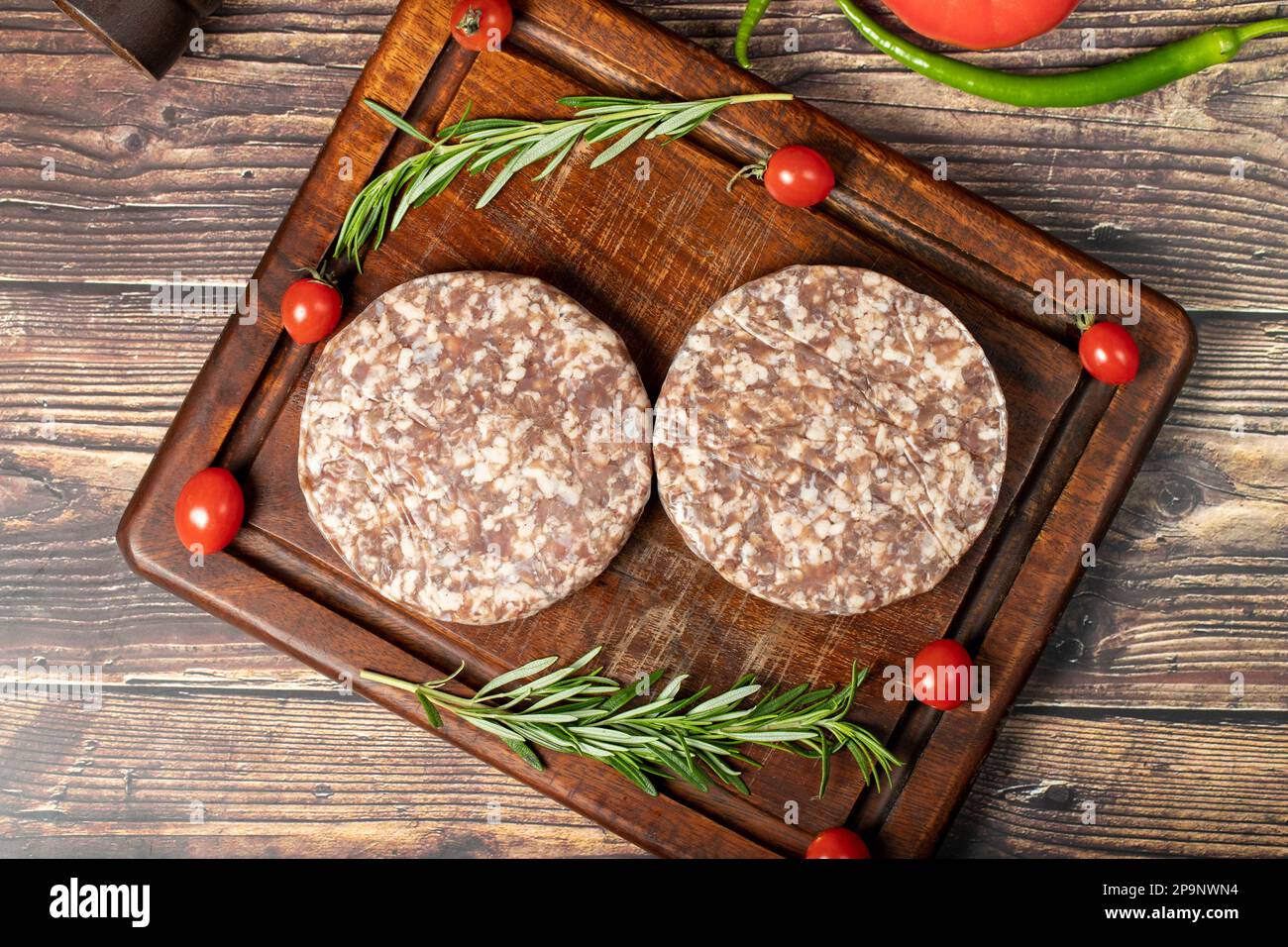 Raw hamburger patties. Beef hamburger patties prepared with spices