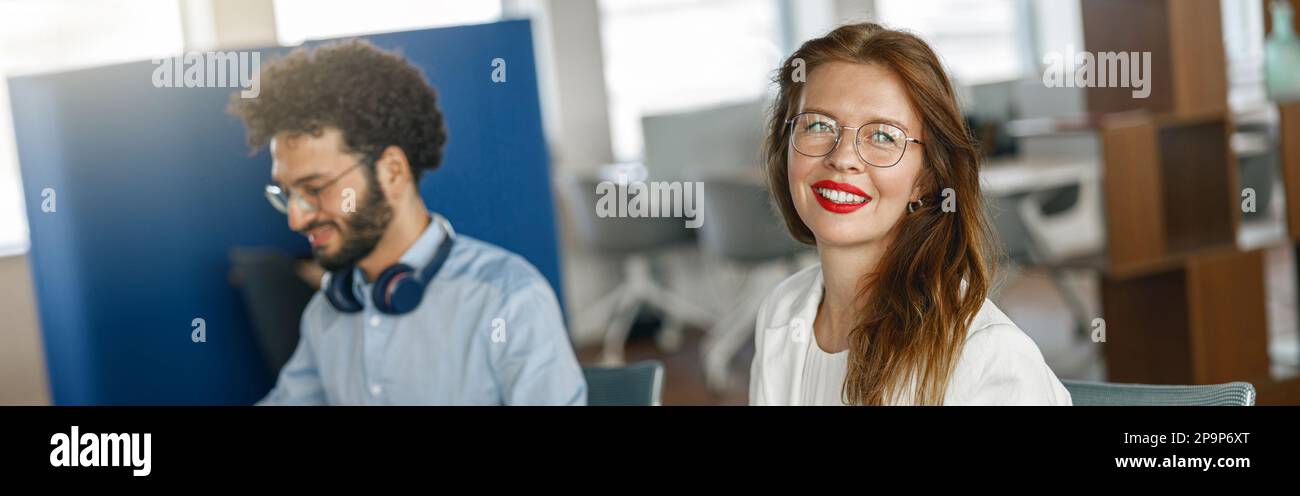 Two coworkers working together analyzing the charts in office Stock ...