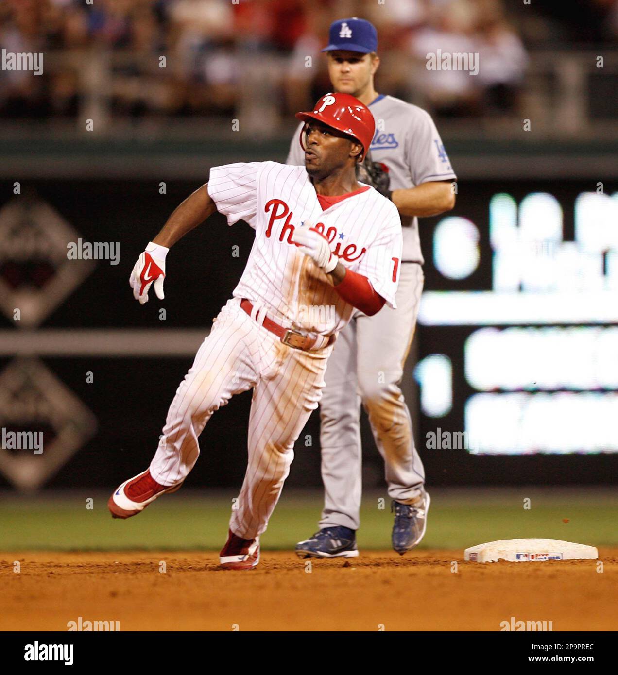 Philadelphia Phillies' Jimmy Rollins makes the turn at second base past Los  Angeles Dodgers' Jeff Kent, and heads to third on a triple off of starting  pitcher Chad Billingsley in the sixth