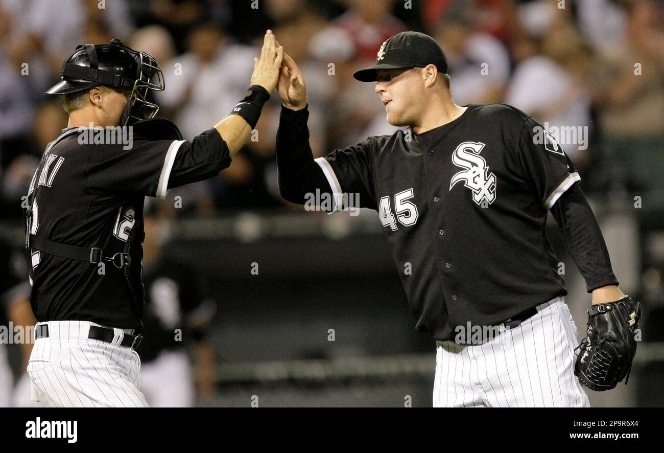 Chicago White Sox catcher A.J. Pierzynski, left, and relief pitcher Bobby  Jenks celebrate after Chicago's 5-0 win over the Seattle Mariners in a  baseball game in Chicago, Tuesday, Aug. 19, 2008. (AP