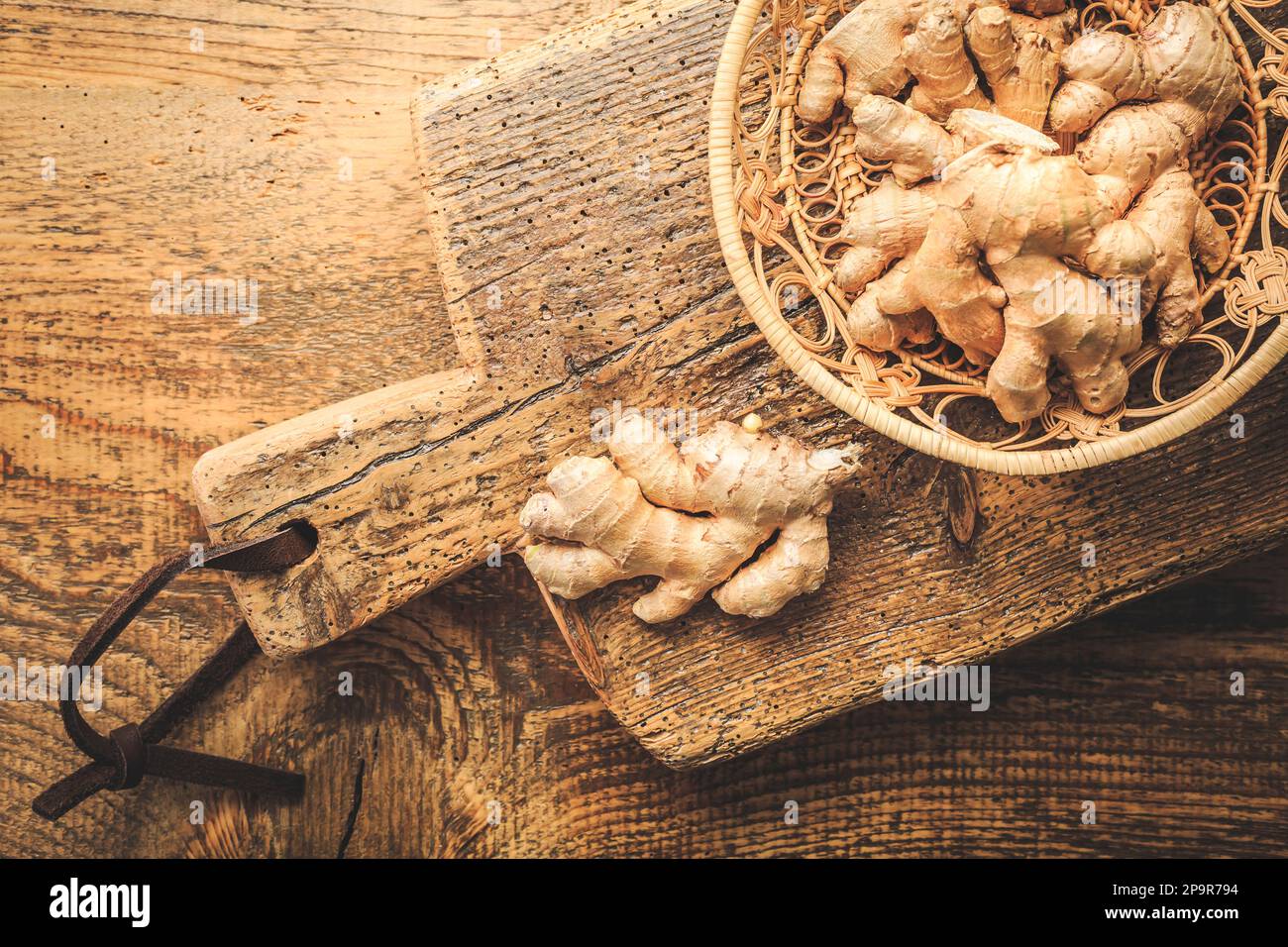 Fresh organic ginger roots on wooden background. Stock Photo