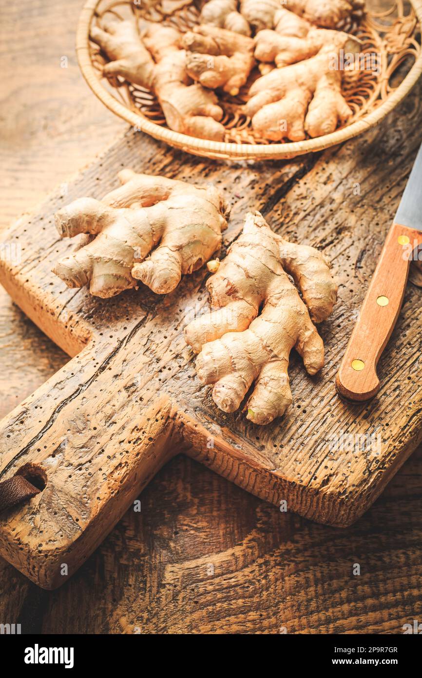 Fresh organic ginger roots on wooden background. Stock Photo