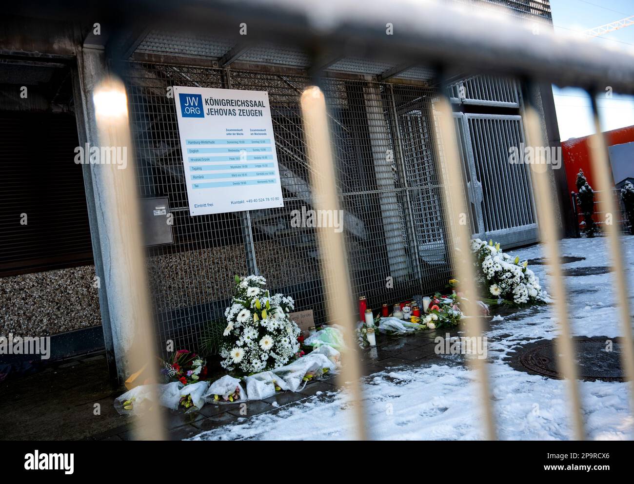 Hamburg, Germany. 11th Mar, 2023. Flowers and candles lie and stand in