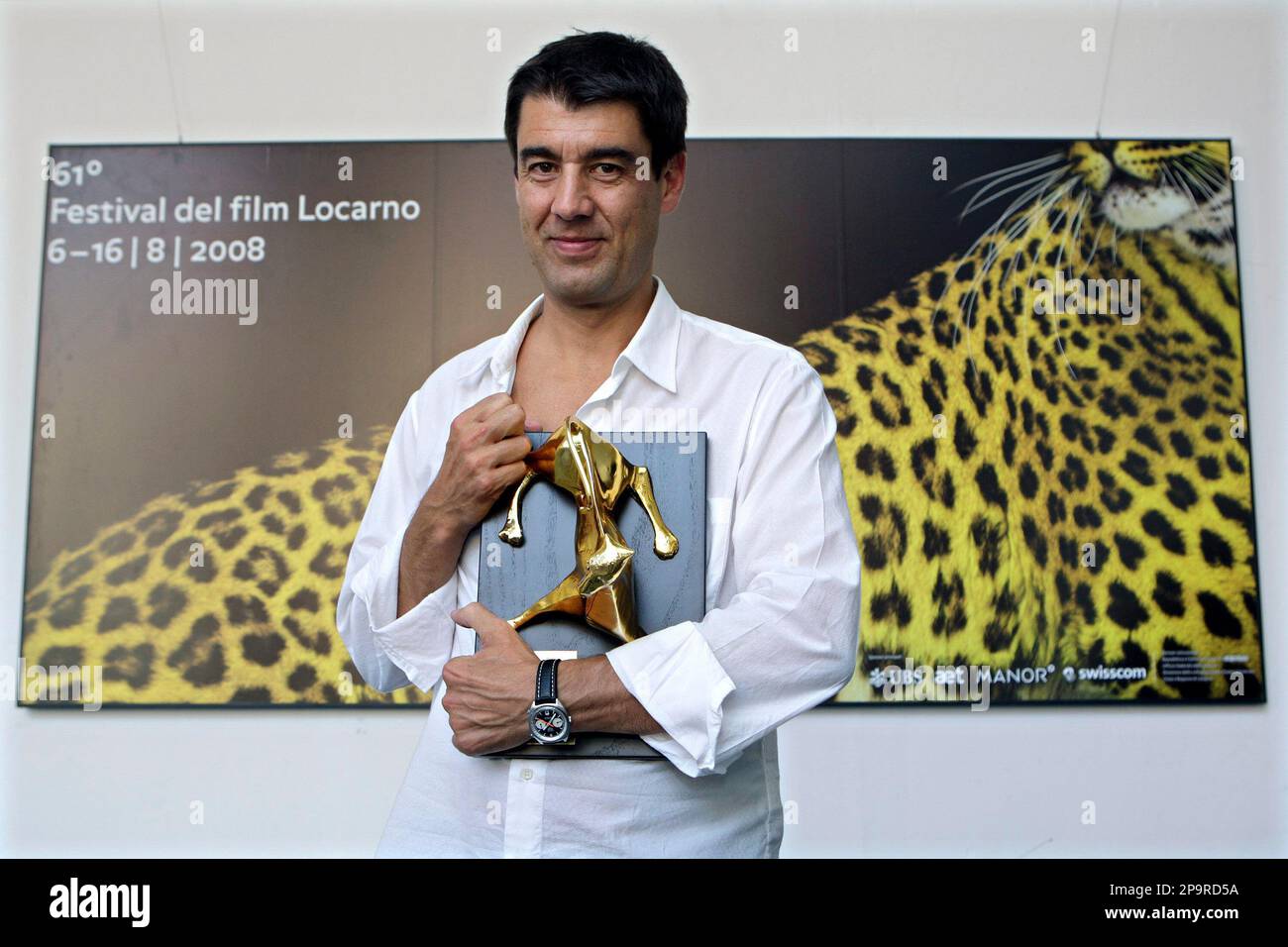 Swiss director Fernand Melgar poses with the Golden Leopard of the  Filmmakers of the Present Competition, he received for his movie "La  forteresse", at the 61st International Film Festival Locarno, Saturday, Aug.