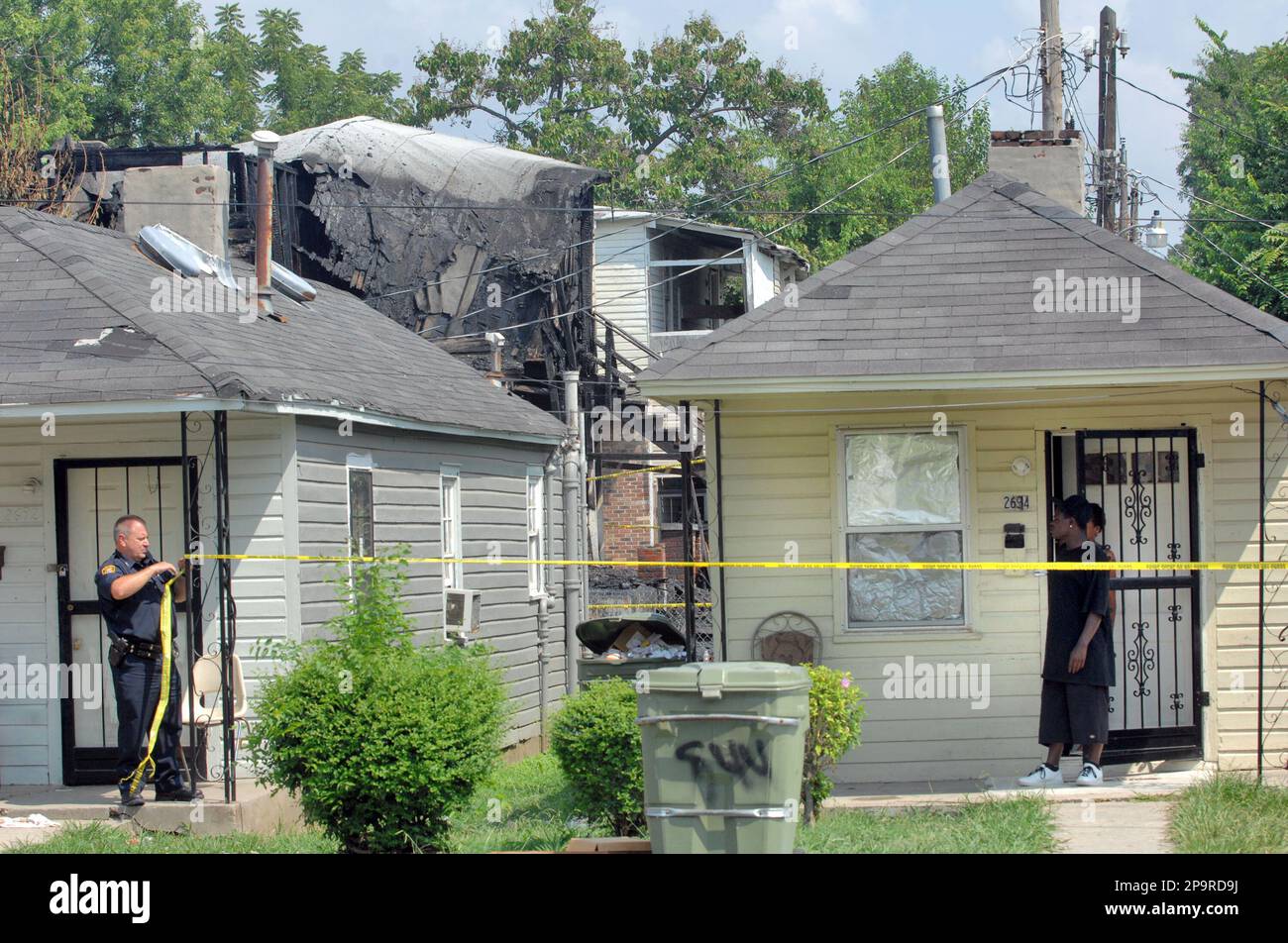 Police cordon off the scene of a house fire in the Orange Mound ...