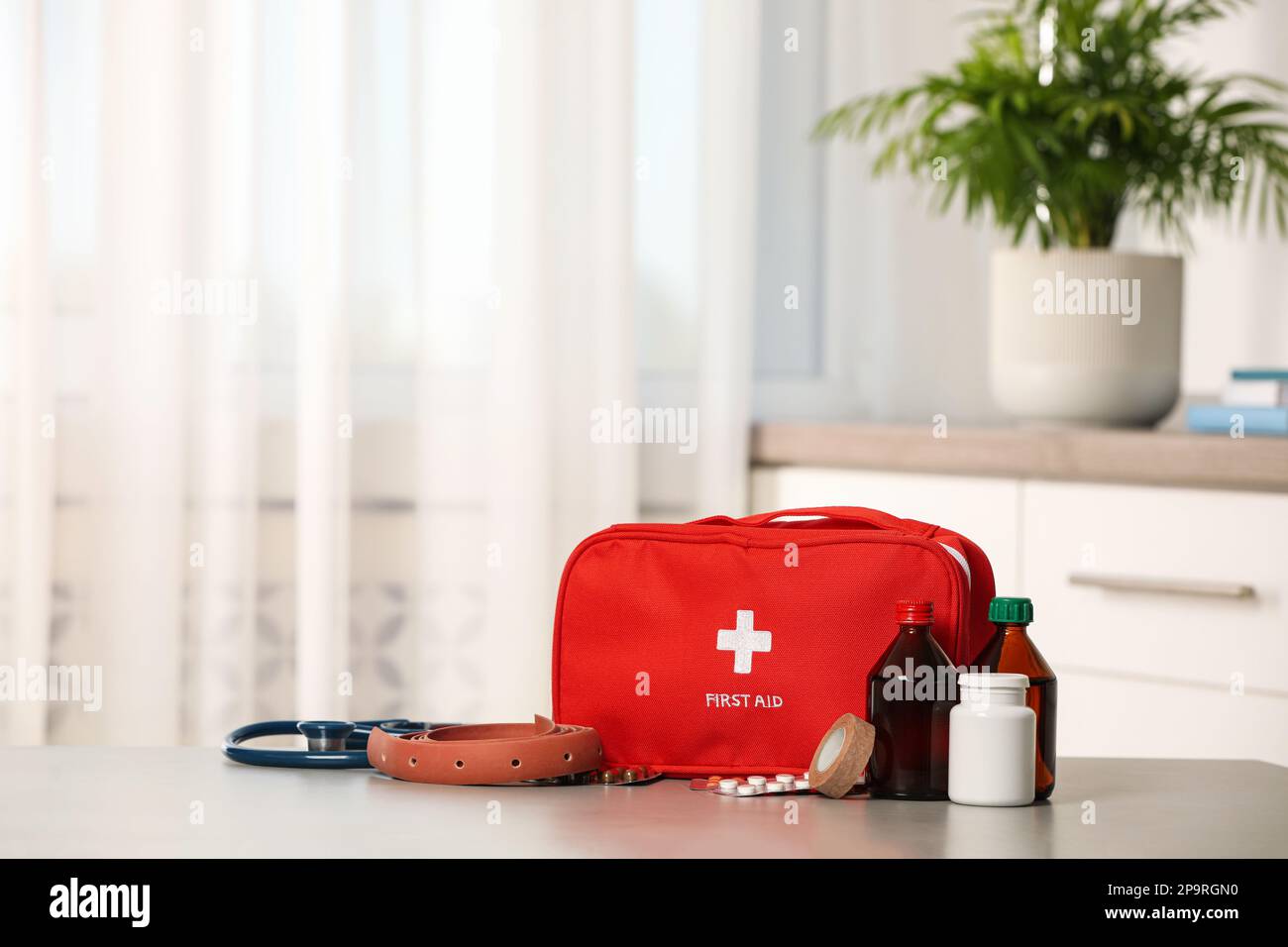 First aid kit on table indoors, space for text Stock Photo - Alamy