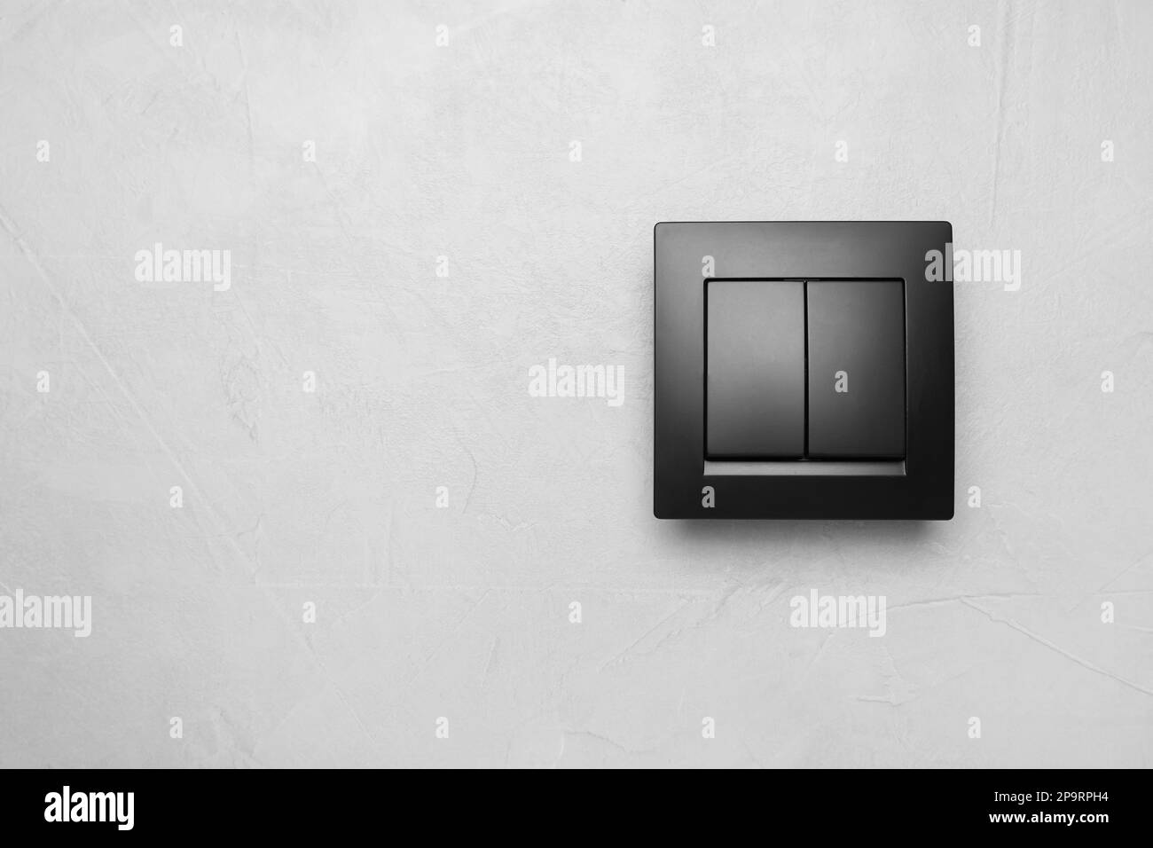 Black light switch on white background. Space for text Stock Photo