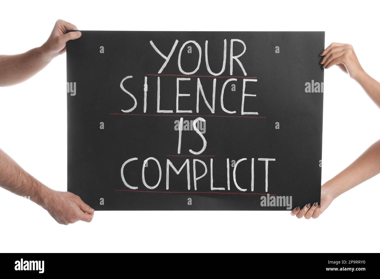 Man and woman holding sign with phrase Your Silence Is Complicit on white background, closeup. Racism concept Stock Photo