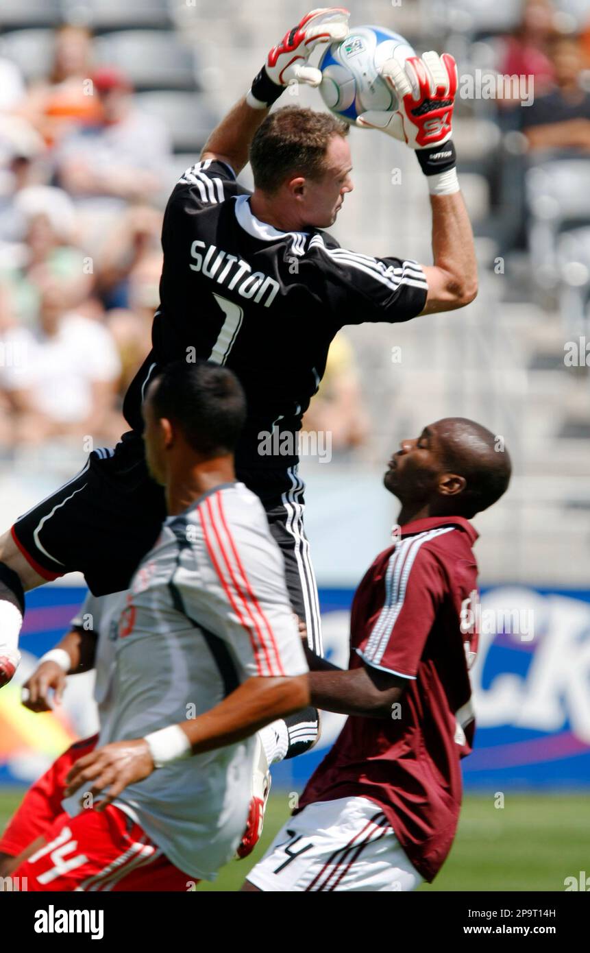 Toronto FC goalie Greg Sutton, back, makes a save as Colorado Rapids ...