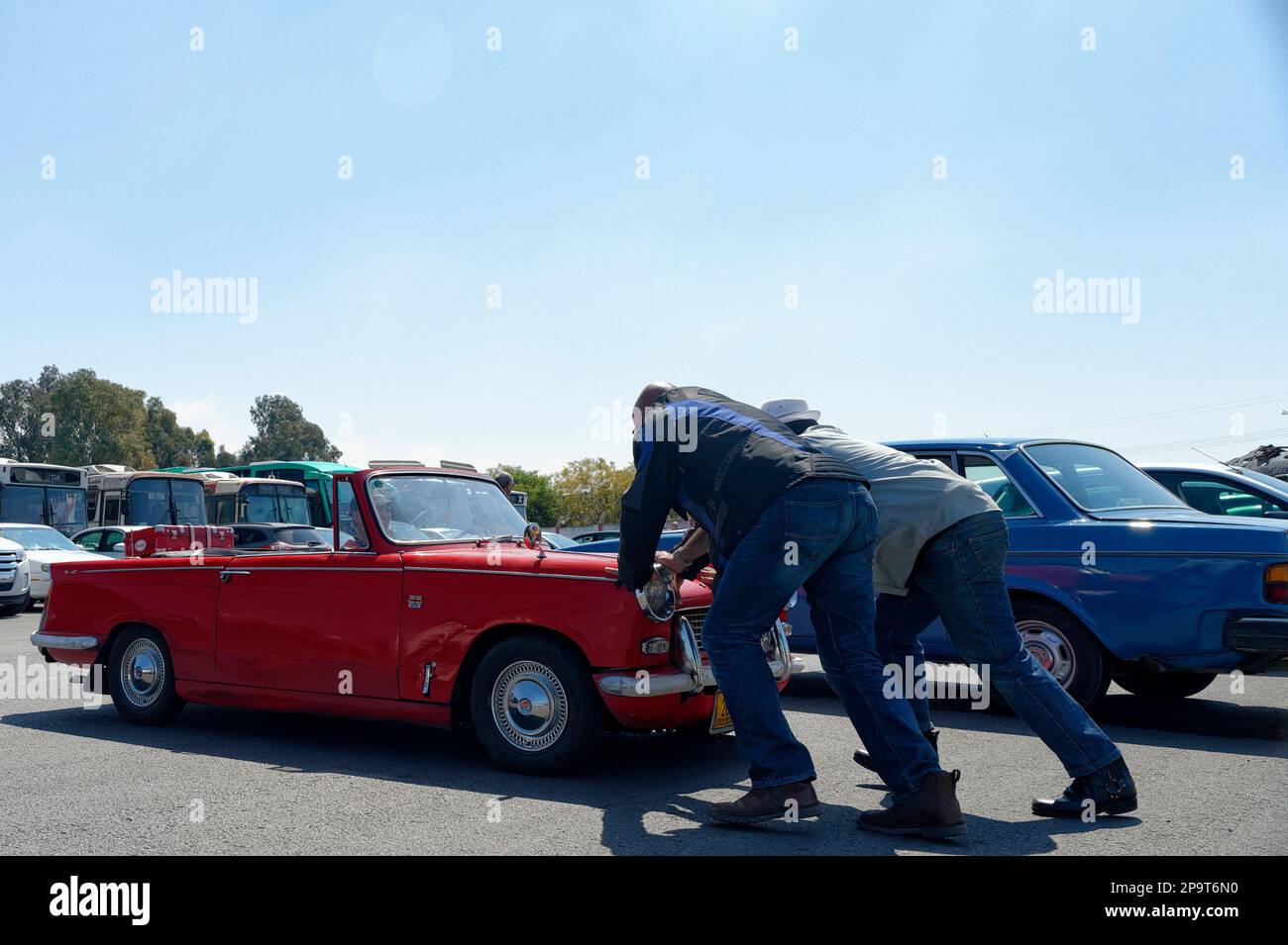 Two men push auto hi-res stock photography and images - Alamy