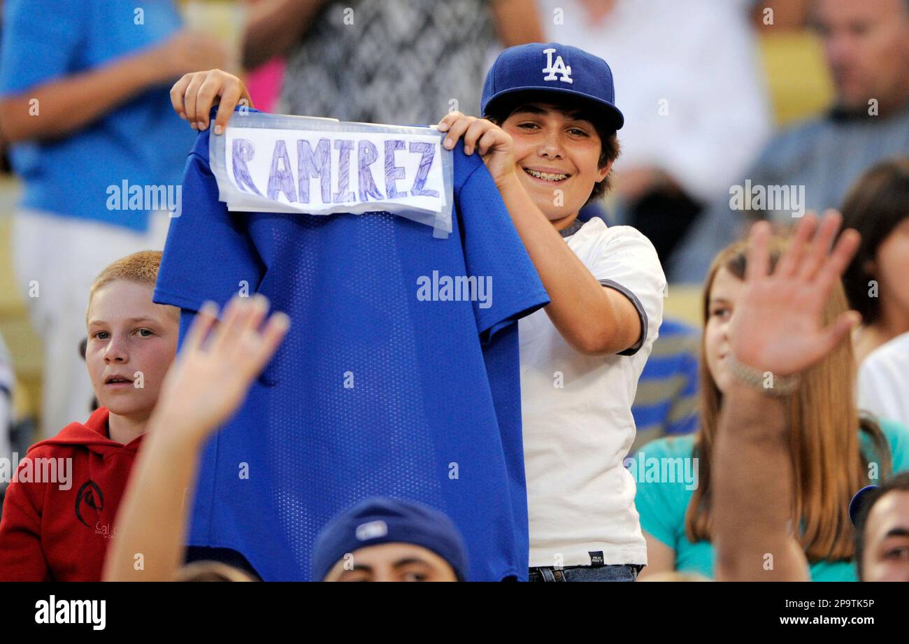 Michael Aronson, age 13, holds up a Dodgers jersey with a home
