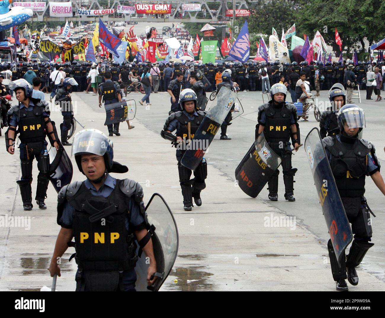 Massive Riot Police Riot police move back to give way for thousands of protesters to march ...