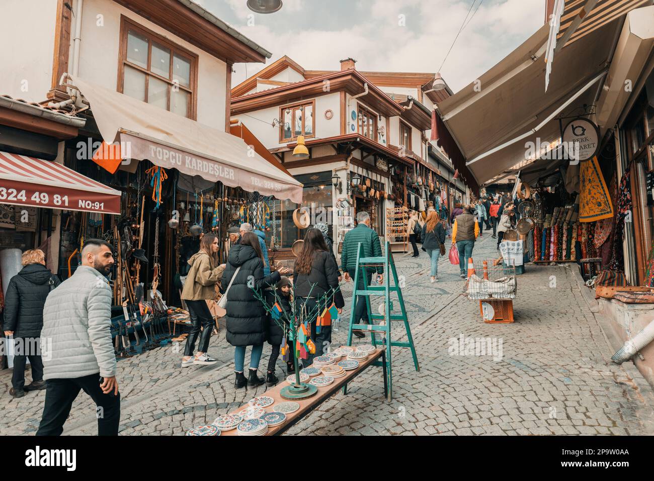 Ankara-Turkey, February 25, 2023: People shopping at the bazaar in Ankara Kaleici, old settlement area inside Ankara Castle. Famous ancient wooden hou Stock Photo