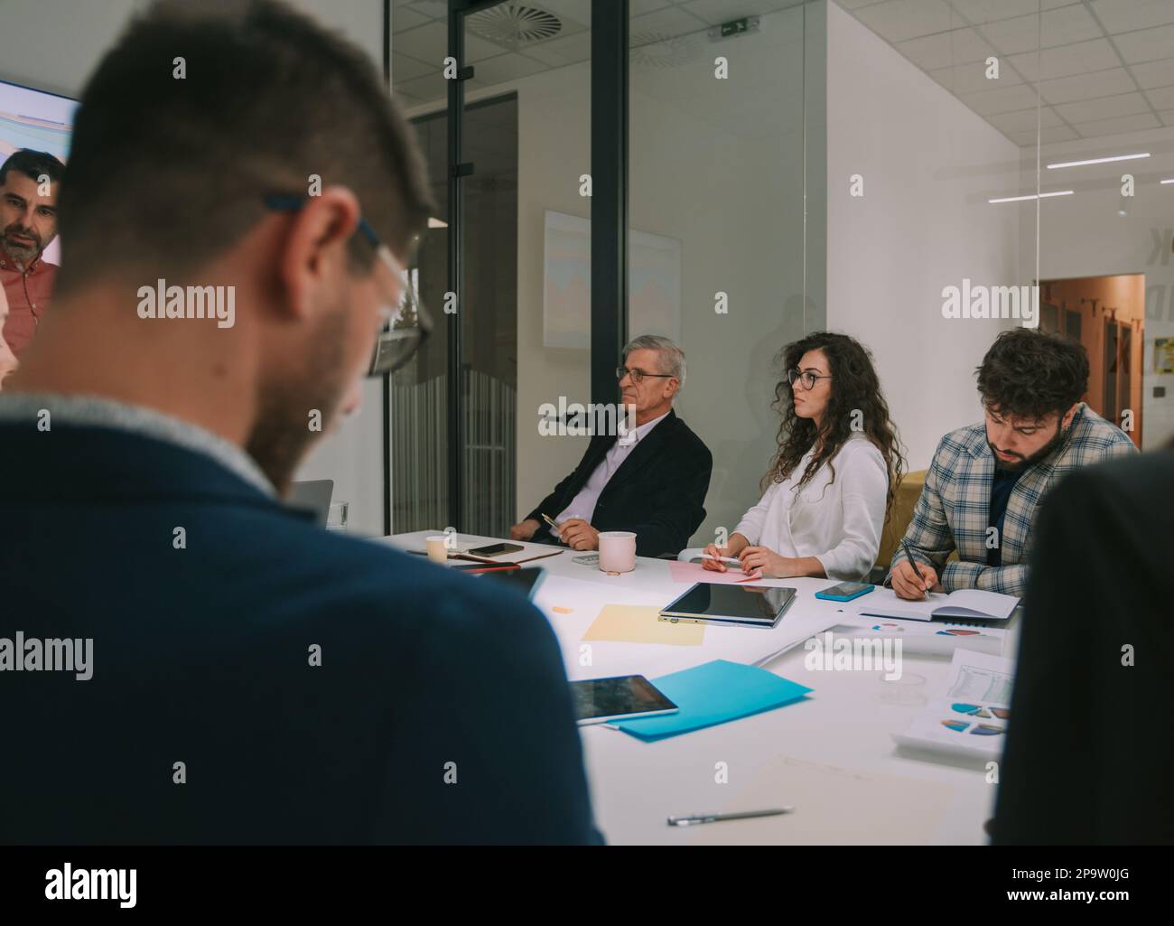 Group of business people having a meeting while sitting at the business ...