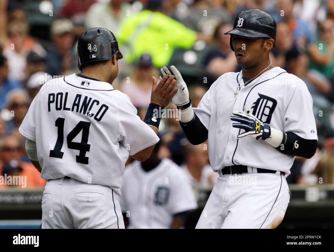 Detroit Tigers Placido Polanco, left, and Carlos Guillen celebrate scoring  on a Miguel Cabrera two-run single in the third inning of a Major League  Baseball game in Detroit, Sunday, July 27, 2008. (